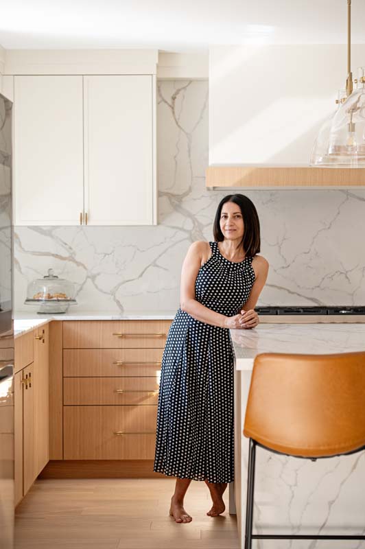 A woman standing in the kitchen
