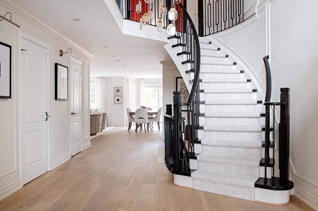 entryway looking up stairs and down a hallway